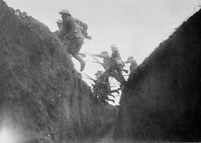 Troops in training, jumping over a trench, 1916-17 by English Photographer